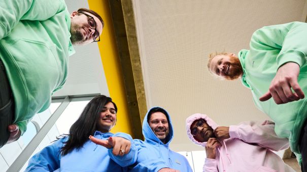 colleagues green blue pink sweatshirts